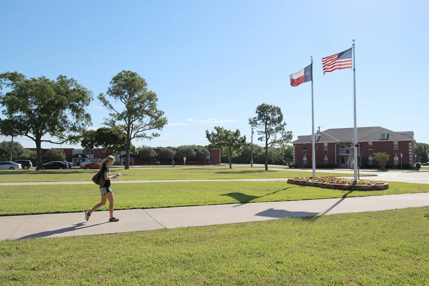 Student Walking Past Dorms